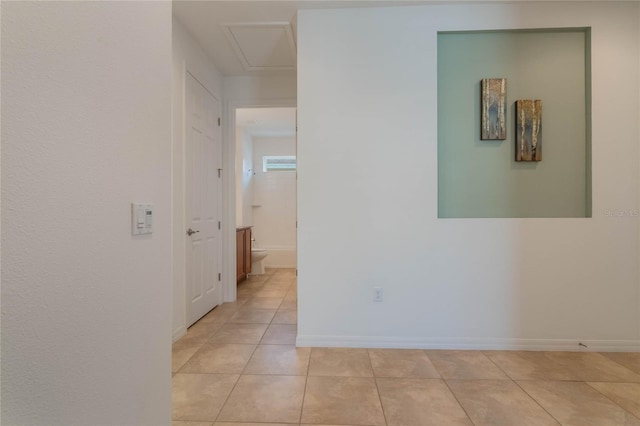 hallway featuring light tile patterned flooring