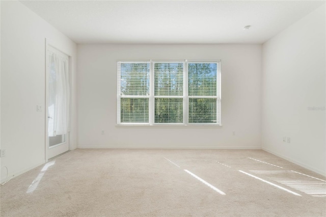 empty room featuring light colored carpet