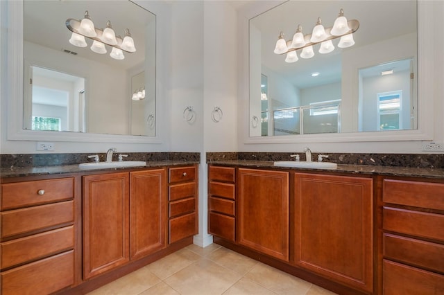 bathroom with vanity, tile patterned floors, and an enclosed shower