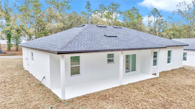 rear view of house with a patio