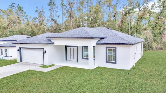 view of front of house with a garage and a front yard