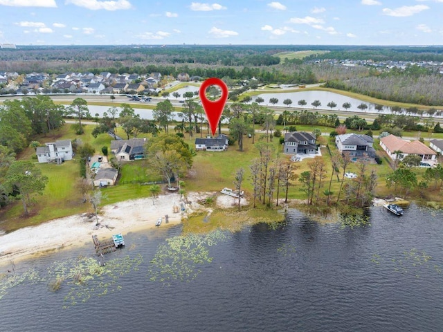 birds eye view of property featuring a residential view and a water view