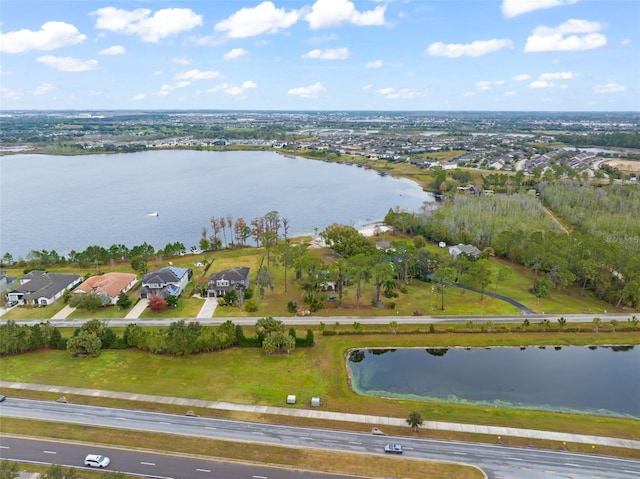 birds eye view of property with a water view