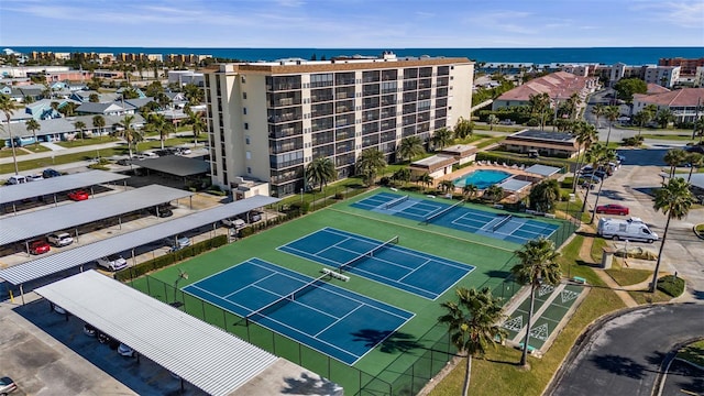 birds eye view of property with a water view