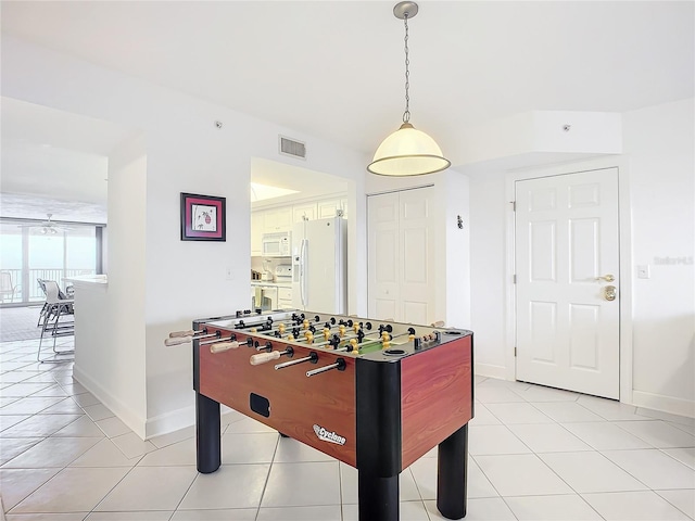 recreation room with light tile patterned flooring