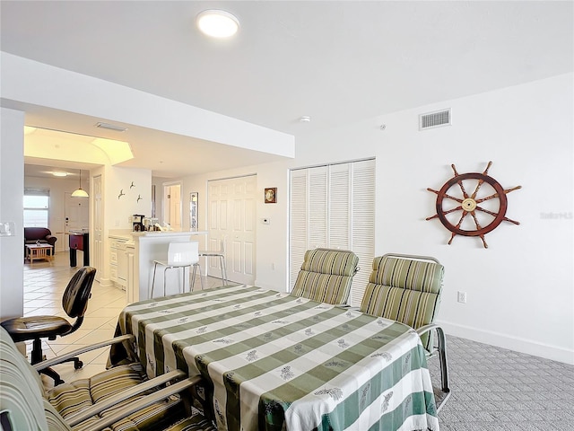 dining space with light colored carpet