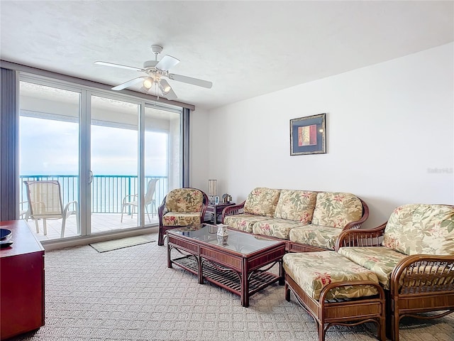 living room with ceiling fan and light carpet