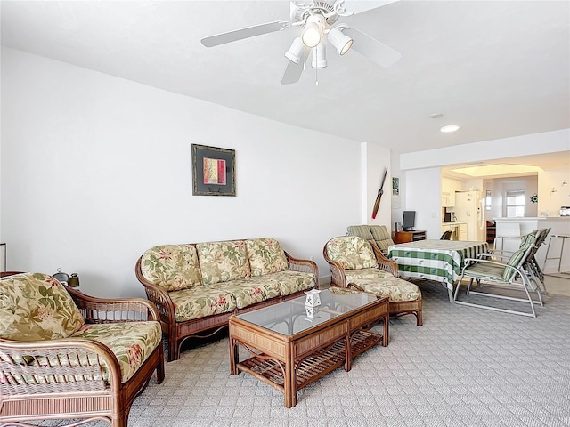 living room featuring ceiling fan and light carpet