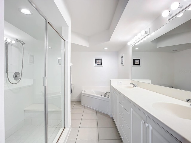 bathroom with tile patterned floors, separate shower and tub, and vanity