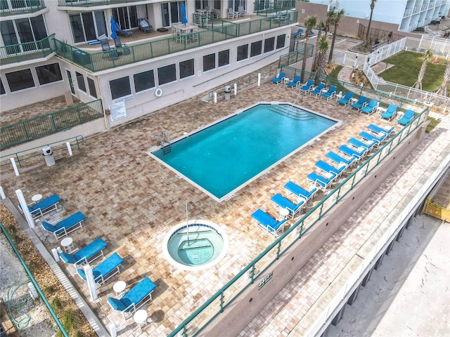 view of pool with a patio area and central AC