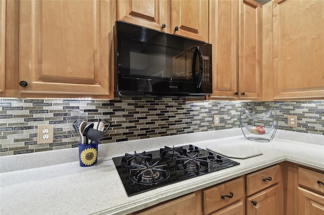 kitchen featuring decorative backsplash and black appliances