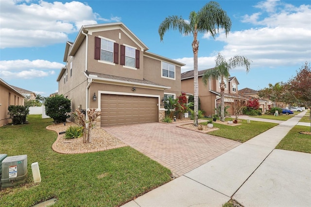 view of front of house with a front lawn and a garage