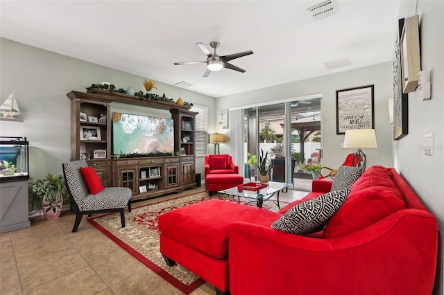 living room with tile patterned flooring and ceiling fan