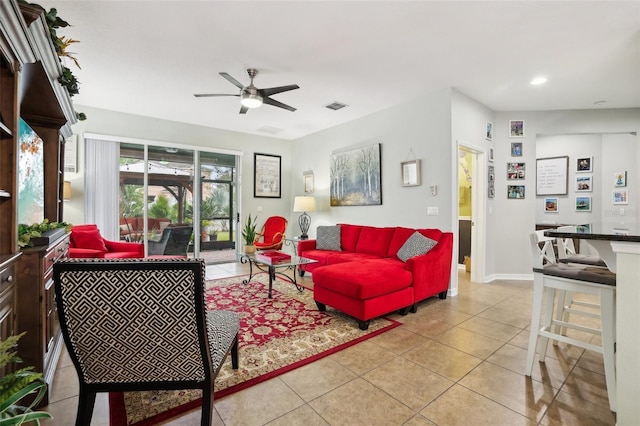 living room featuring ceiling fan and light tile patterned flooring