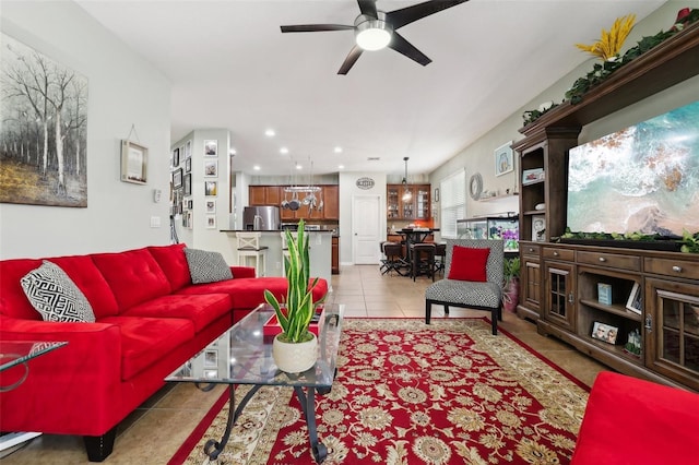 tiled living room with ceiling fan