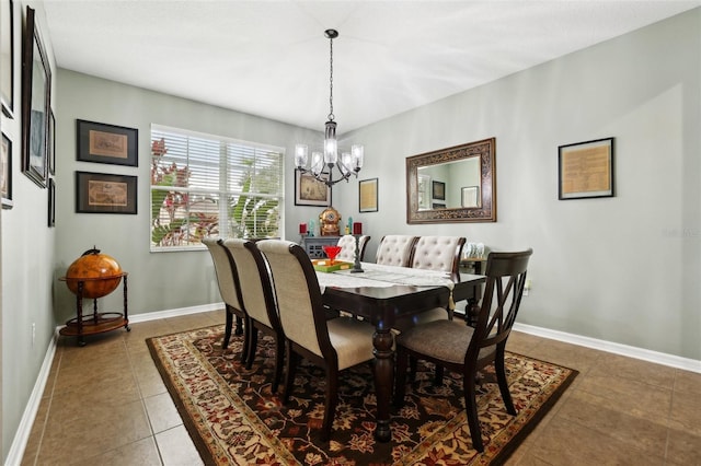 tiled dining space featuring a notable chandelier