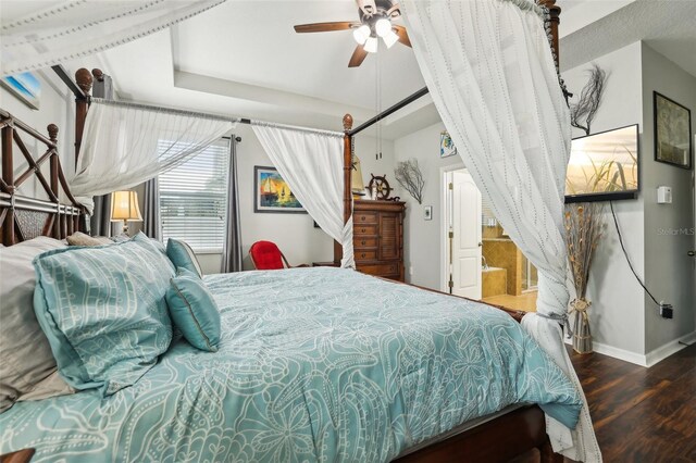 bedroom with ceiling fan and dark hardwood / wood-style floors