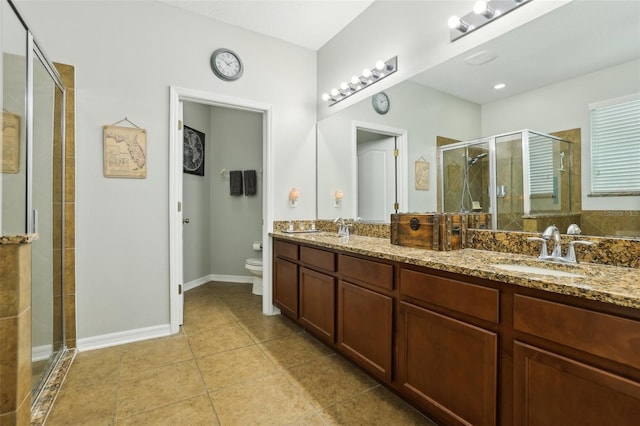 bathroom with walk in shower, vanity, and toilet