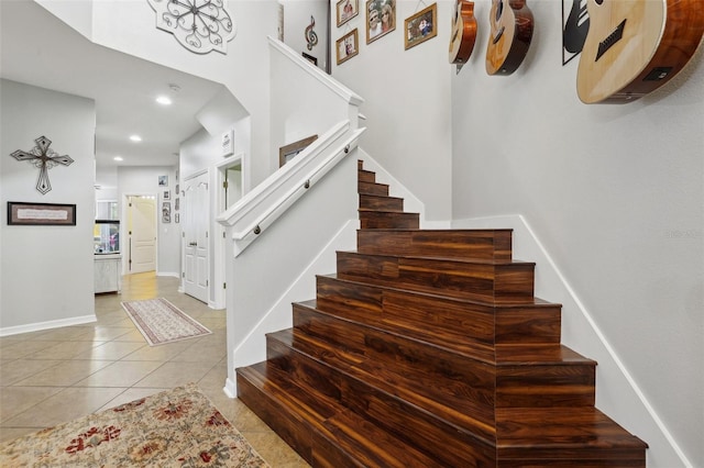 stairway with tile patterned flooring