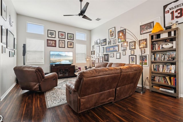 living room with dark hardwood / wood-style floors and ceiling fan