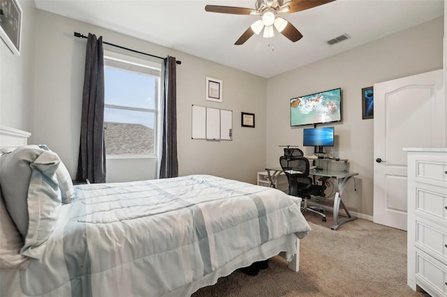 bedroom with light carpet and ceiling fan