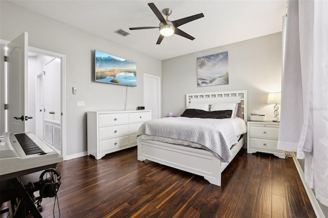 bedroom with dark hardwood / wood-style flooring and ceiling fan