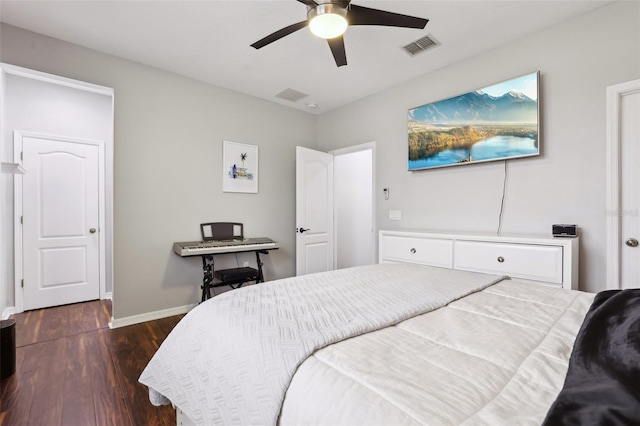 bedroom with ceiling fan and dark wood-type flooring