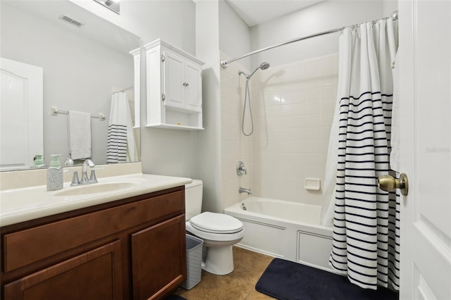 full bathroom featuring tile patterned flooring, vanity, toilet, and shower / bath combo with shower curtain