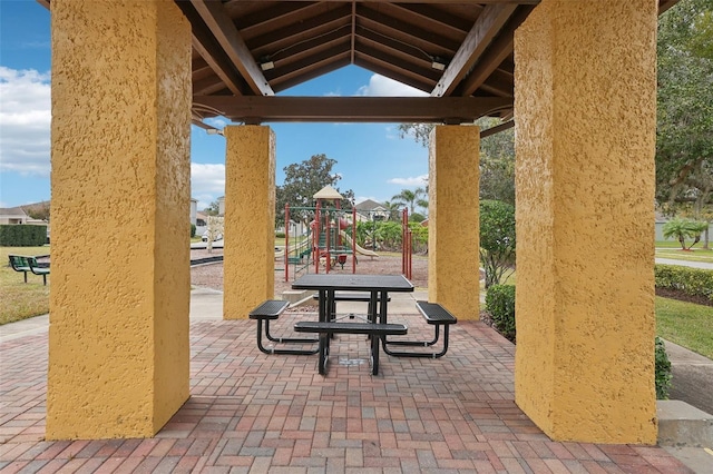 surrounding community featuring a playground and a gazebo