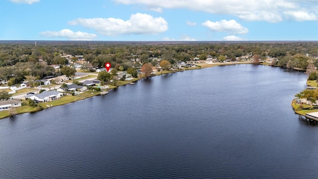 aerial view featuring a water view and a wooded view