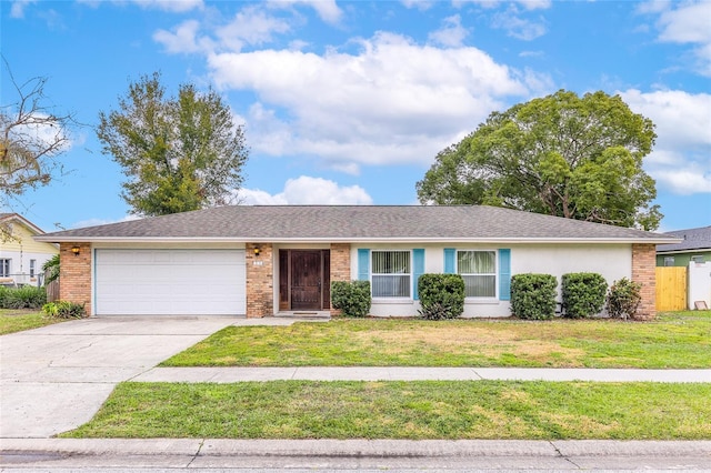 ranch-style house with a garage, driveway, brick siding, a front lawn, and stucco siding