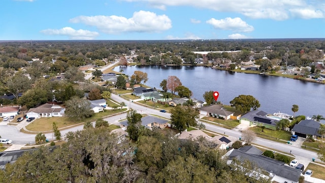 birds eye view of property with a water view and a residential view