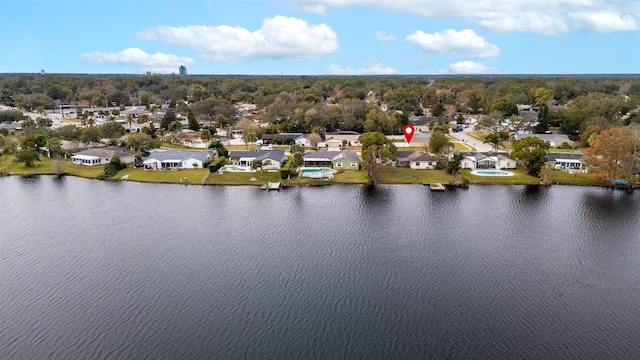 drone / aerial view with a water view and a residential view