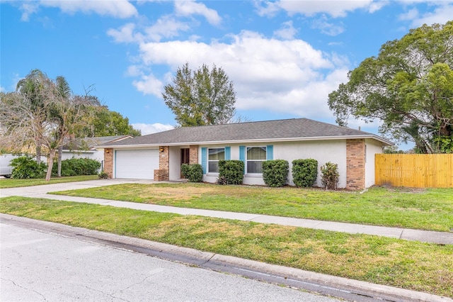 single story home featuring a garage, fence, driveway, stucco siding, and a front lawn