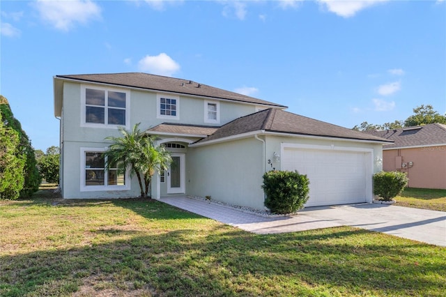 view of front of property featuring a front yard and a garage