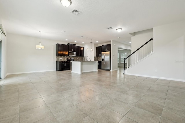 unfurnished living room with light tile patterned flooring