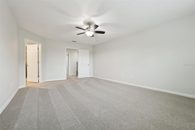 unfurnished bedroom with light colored carpet and ceiling fan