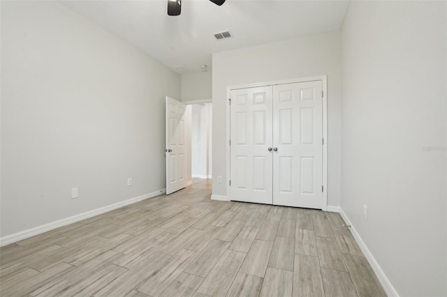 unfurnished bedroom featuring a closet and ceiling fan