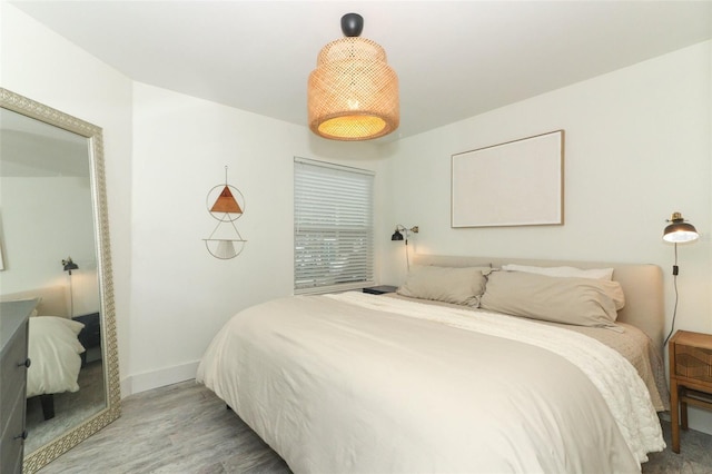 bedroom with hardwood / wood-style flooring