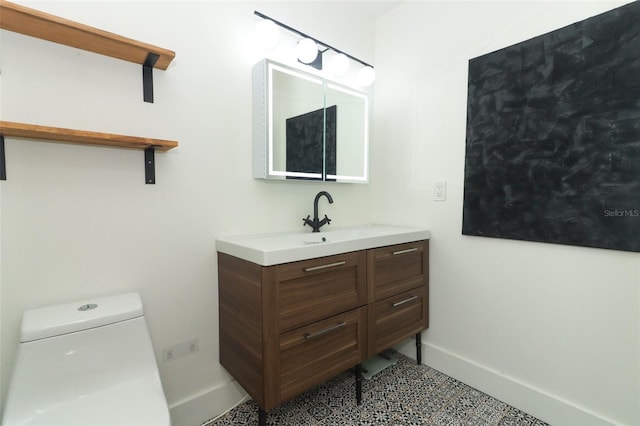 bathroom featuring vanity and toilet