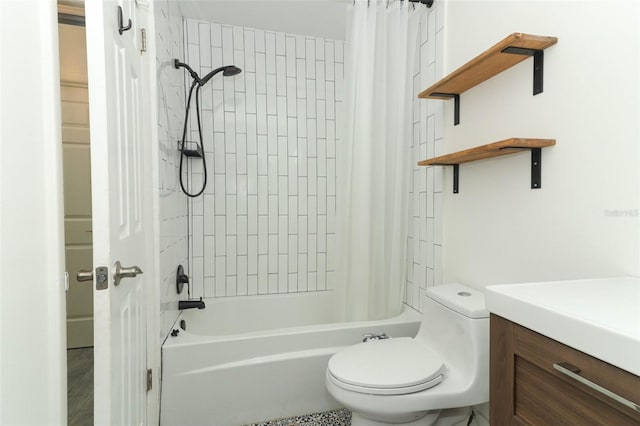 full bathroom featuring shower / bath combo with shower curtain, vanity, and toilet