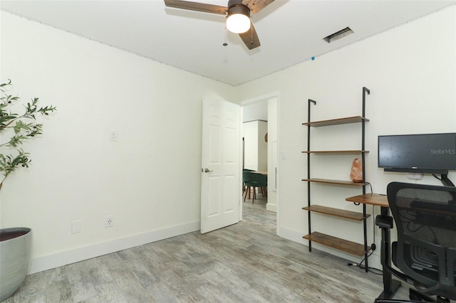 office with ceiling fan and light hardwood / wood-style flooring