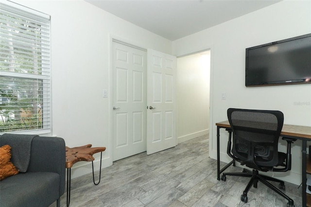 office with light wood-type flooring