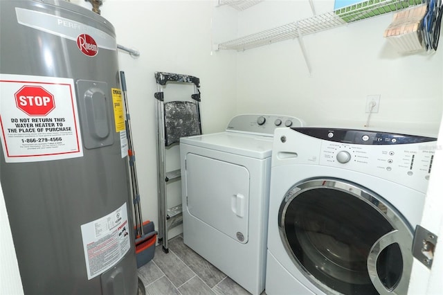 laundry room with washer and clothes dryer and electric water heater