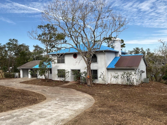 view of front facade featuring central AC