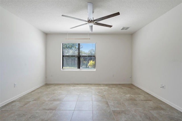 unfurnished room with a textured ceiling and ceiling fan