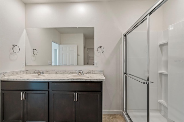 bathroom featuring vanity and an enclosed shower