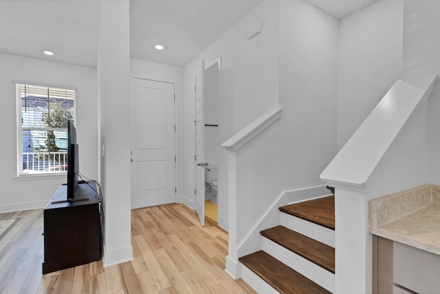 staircase featuring hardwood / wood-style floors