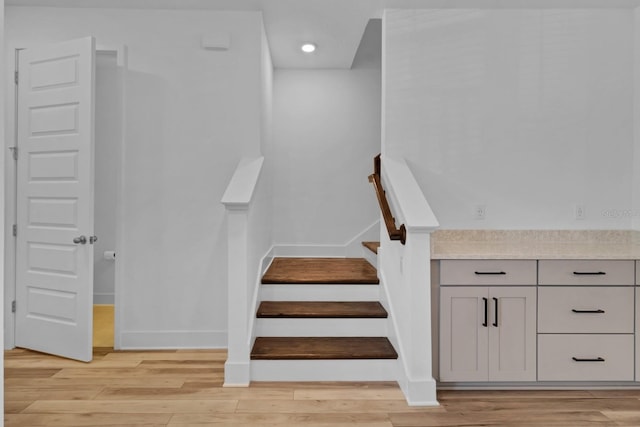 stairway with wood-type flooring