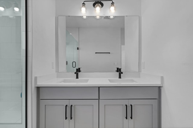 bathroom featuring an enclosed shower and vanity